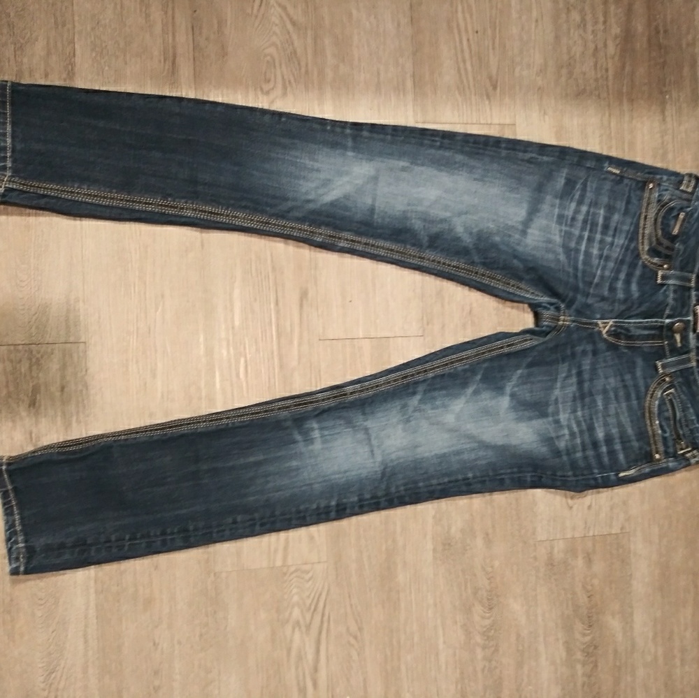 be Rock by Express dark faded embroidered jeans.